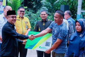 Pj.Bupati Kampar Firdaus Launching Program Kerja Keras Kerja Bebas Cemas BPJS Ketenagakerjaan