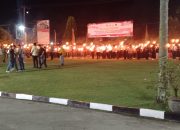 Kapolres Kampar Pimpin Upacara Taptu dan Wabup Lepas Pawai Obor di Mapolres