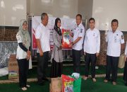 Ringankan Beban Warga, Dinsos Kampar Bagikan Bansos untuk 136 Penerima